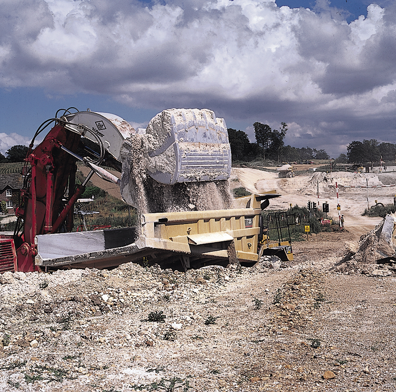 Digger loading a dump truck